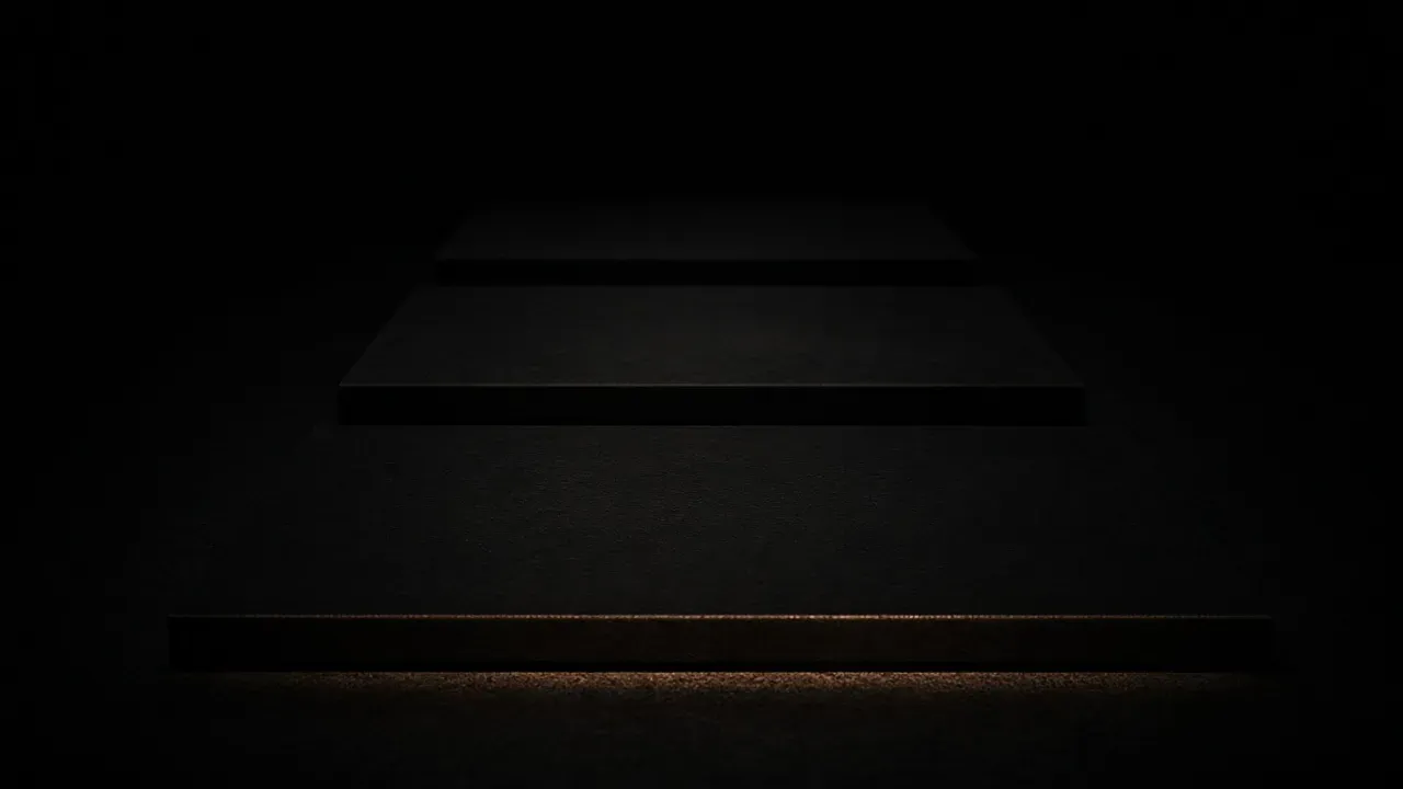 Three dark steps receding into black, the nearest step edged with a warm line along its front